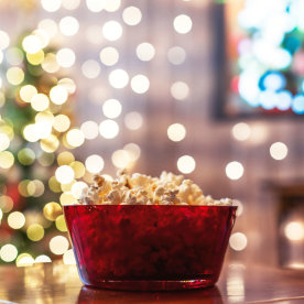 bowl of popcorn in front of christmas tree